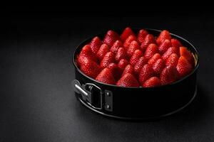 Delicious sweet cake or cheesecake with mascarpone cheese and strawberries photo