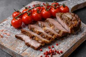 Delicious juicy pork or beef steak grilled with salt, spices and herbs photo