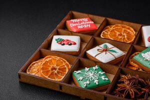 Beautiful colored Christmas gingerbread cookies for the design and decoration photo