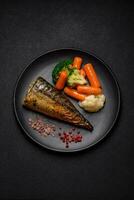 Delicious grilled ocean mackerel with salt, spices and herbs photo