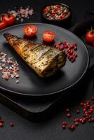 Delicious grilled ocean mackerel with salt, spices and herbs photo
