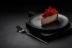 Delicious fresh cheesecake with strawberries, syrup and mascarpone cheese photo