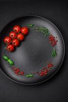 Ingredients for cooking cherry tomatoes, salt, spices and herbs photo