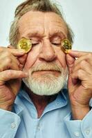 Portrait elderly man cryptocurrency bitcoin face close up investment unaltered photo