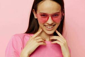 positive woman pink glasses and t-shirt hand gesture isolated background photo