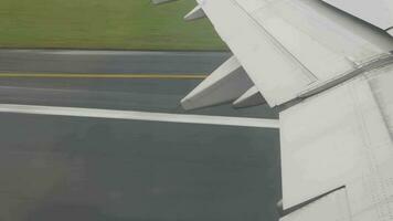 view from inside cabin of airplane aircraft while take off from runway in the airport video