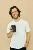 Attractive man with a black glass in a white t-shirt isolated background photo