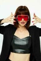 beautiful woman in red with stylish glasses a leather suit black jacket Lifestyle unaltered photo