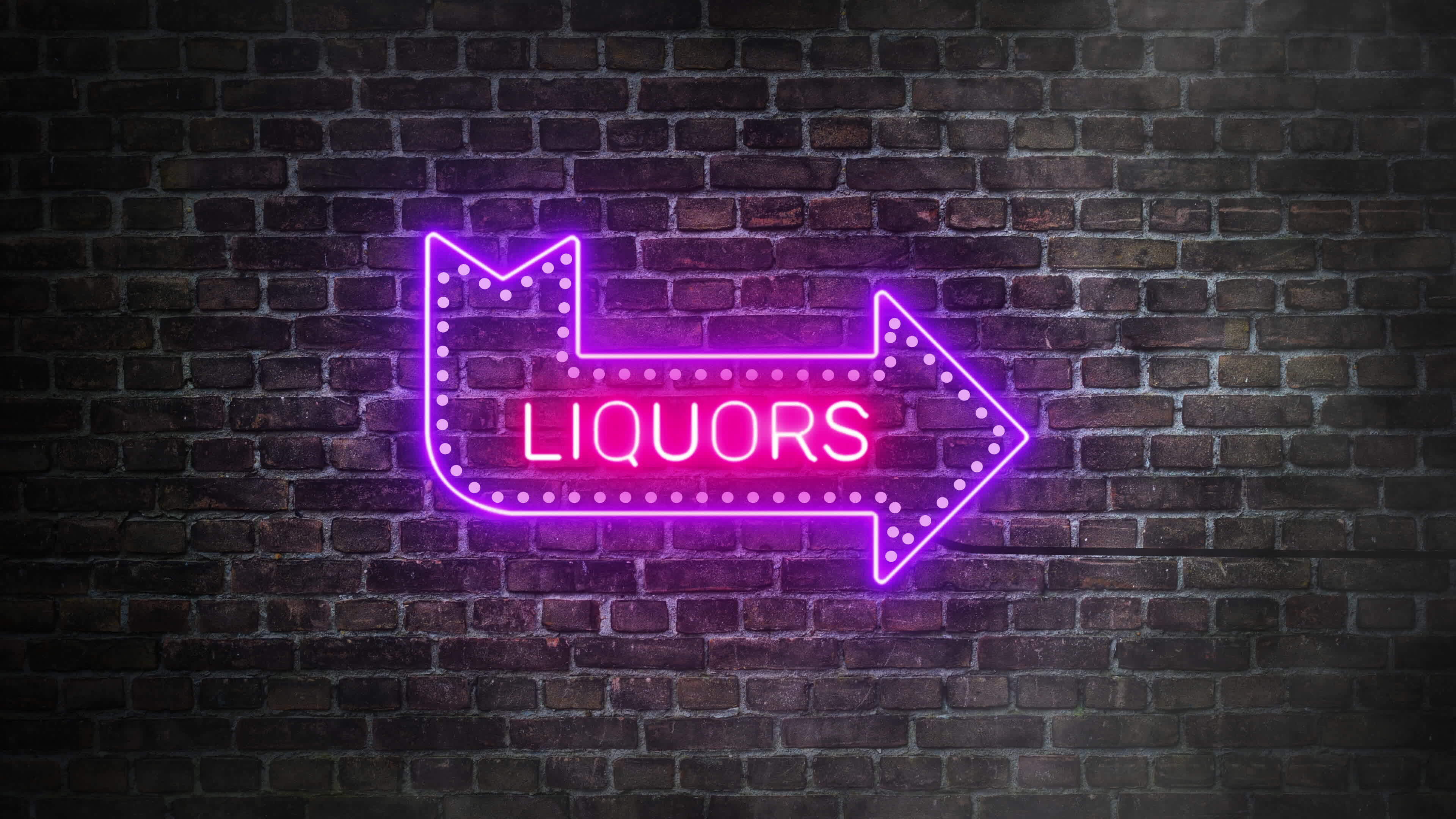 Liquors arrow neon real signboard on bricks wall background. Horizontal