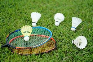 Selective focus on yellow shuttlecock in badminton rackets. Concept, sport equipment, doing sport and exercise for health, recreation activity. photo