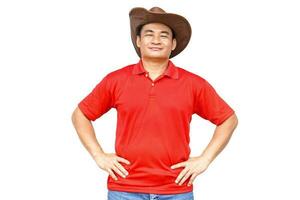 Handsome Asian man wears cowboy hat, red shirt,put hands on waist, feels confident , isolated on white background. Copy space of adding text or advertisement. photo