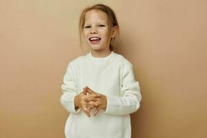 Portrait of happy smiling child girl childrens style emotions fun childhood unaltered photo