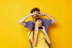 teenagers Friendship posing fun studio yellow background unaltered photo