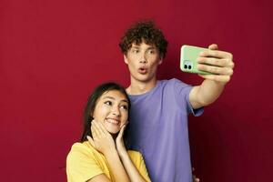 young man and girl take a selfie posing hug isolated background photo