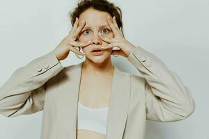 cheerful woman In a light classic suit hand gesture light background unaltered photo