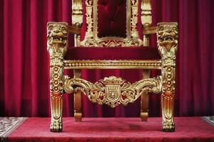Part of the red royal chair against the background of red curtains. A place for a king. Throne photo