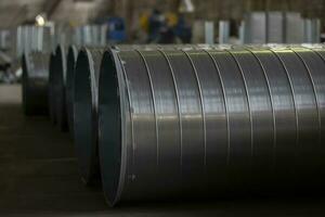 Metal stainless ventilation pipes at a metallurgical plant. Rolled metal. photo