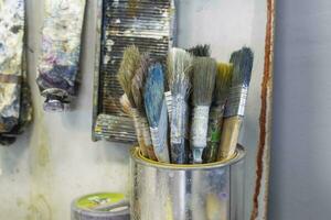 A tool for the artist. There are many paint brushes in the box. photo