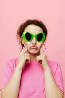 Stylish teenager girl model with green glasses decoration gesture with his hands photo