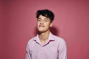 A young man posing fashion pink shirt modern style pink background unaltered photo