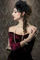 Retro woman portrait. Luxurious lady in vintage style from 20s or 30s. photo