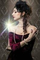 Retro woman portrait. Luxurious lady in vintage style from 20s or 30s. Photo of a girl in vintage style.