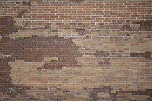 Texture of an old brick wall in various colors. Brick surface. photo