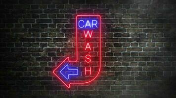 coche lavar real neón letrero en ladrillos pared antecedentes. coche lavar letras en azul y rojo neón colores con flecha. concepto de escaparate. video