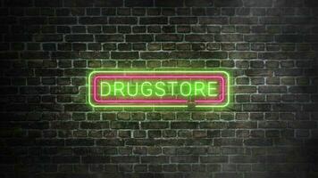Drugstore neon signboard on bricks wall background. Luminous signboard with green and pink neon colors. Concept of drug stores and pharmaceutical companies. Illuminated neon frame and word. video