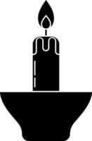 Illuminated candle glyph icon in Black and White color. vector