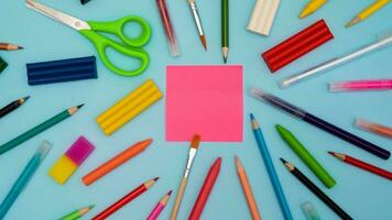 Back to school soon. buying stationery, flatley, a place to copy your text or advertising on a bright sticker. Bright background. photo