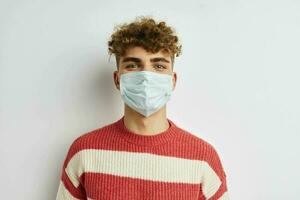 kinky guy in sweater medical mask safety photo