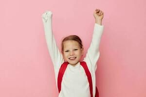 Portrait of happy smiling child girl kids style backpack school isolated background photo