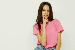 positive woman in a pink t-shirt casual clothes pink background photo