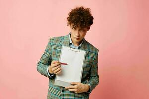 guy with red curly hair in a plaid jacket copy-space folder isolated background unaltered photo