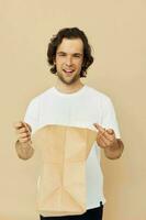 handsome man paper grocery bag posing Lifestyle unaltered photo