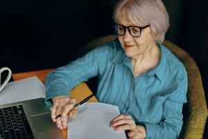 A businesswoman documents work sheet of paper and pen Freelancer works unaltered photo