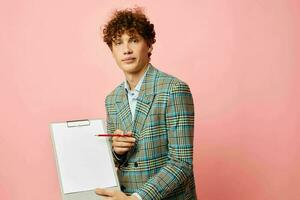 portrait of a young curly man in a plaid jacket copy-space folder isolated background unaltered photo