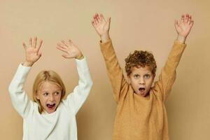 Portrait of cute children in sweaters together fun isolated background photo