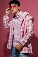 handsome guy pink shirt and glasses jacket fashion elegant style pink background unaltered photo