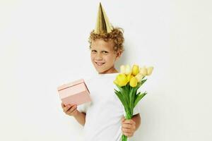 little boy wearing a white t-shirt with a cap on his head birthday gift photo