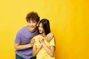 portrait of a man and a woman in colorful t-shirts posing friendship fun Lifestyle unaltered photo