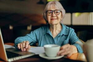 elderly woman documents work sheet of paper and pen Retired woman chatting unaltered photo