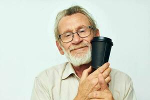 Portrait elderly man with a gray beard in a shirt and glasses isolated background photo