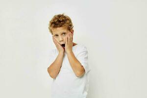 curly boy smile in white t-shirt isolated background photo