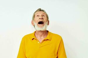 Portrait of happy senior man with a gray beard emotion gestures hands monochrome shot photo