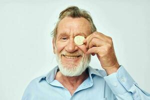 Photo of retired old man cryptocurrency bitcoin face close up investment light background