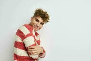 Attractive man in a striped sweater posing Lifestyle unaltered photo