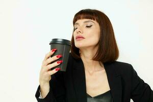 attractive woman in a black suit a mug with a drink charm Lifestyle unaltered photo