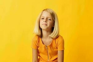 cheerful little girl hand gesture and fun yellow background photo